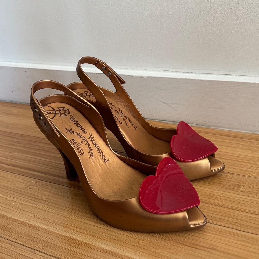 Gold heels by Vivienne Westwood X Melissa. Lightly worn. US Size 8 Women’s.